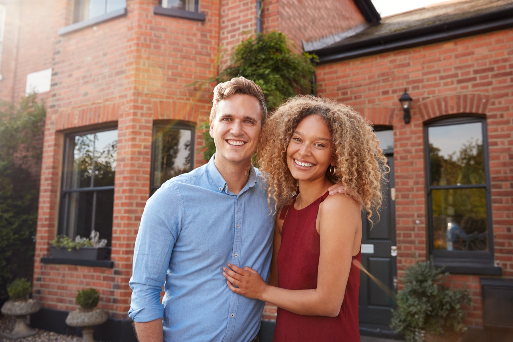 portrait-of-excited-young-couple-standing-outside-2024-10-20-18-45-41-utc